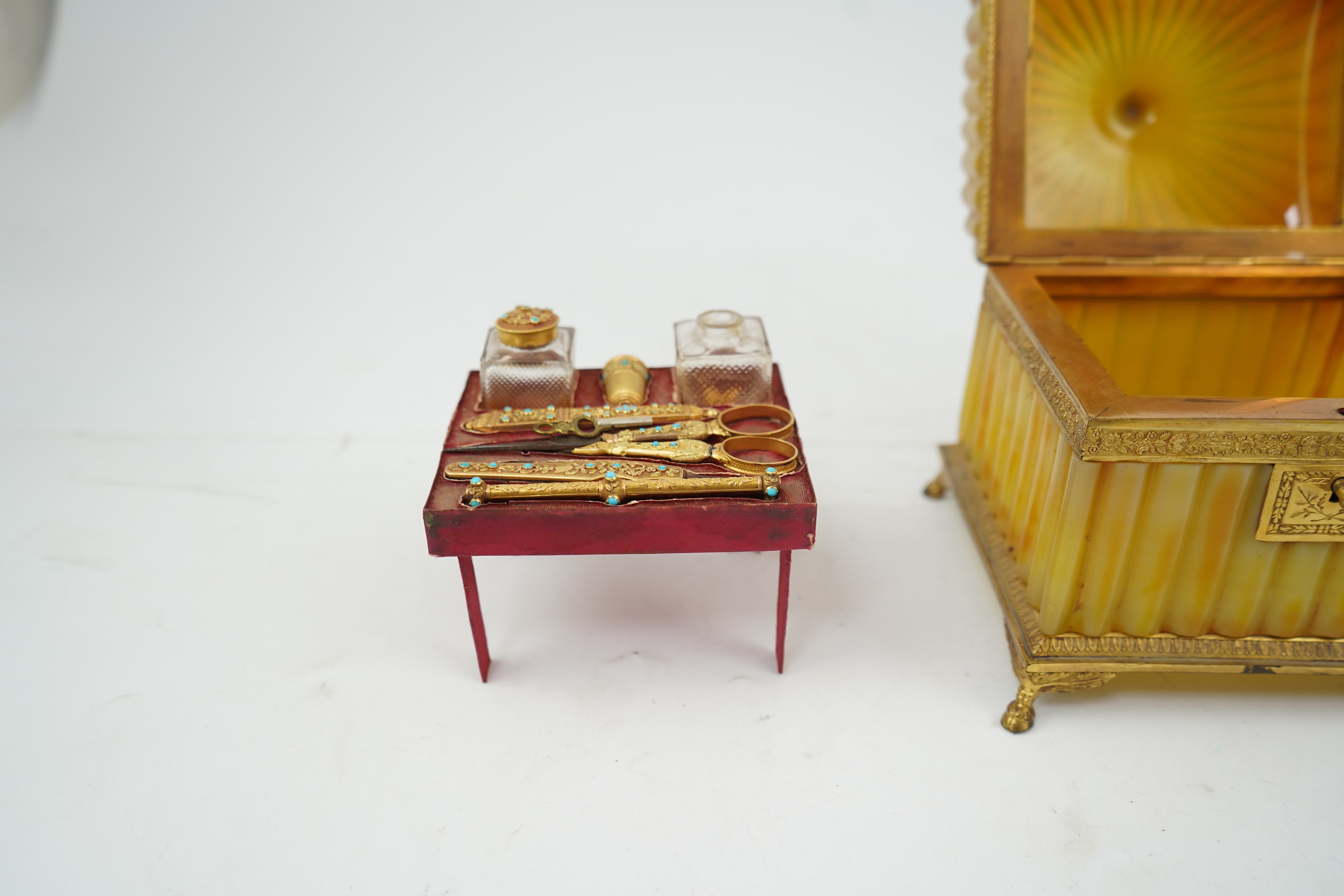 A mid 19th century French opaline glass necessaire box with turquoise and gold mounted accessories